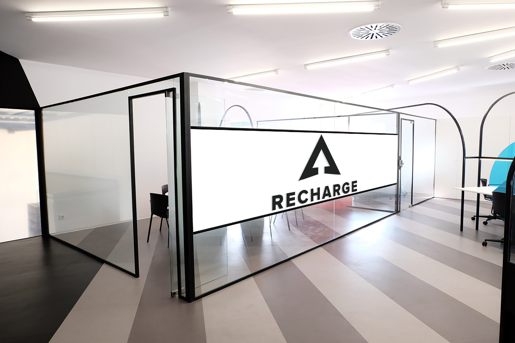 A gorgeous glass Recharge Wellness space in an office with opaque privacy walls